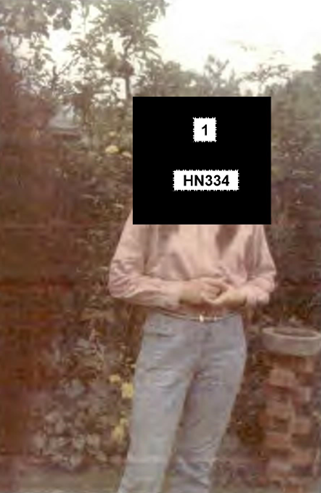 Redacted photo of HN334 Margaret White in her undercover wig in her parents' garden